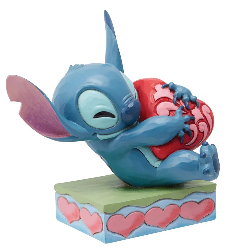 pos-028399382002-47dea149a0d523fca2505bc2fd6db141.jpg Disney Stitch Hugging Heart Enesco Traditions Figurine - Image 1